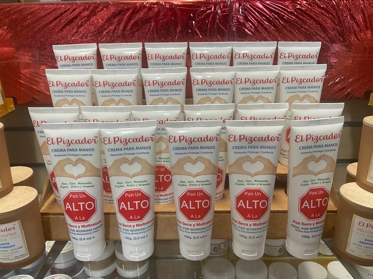 Display of El Pescador skincare products including cream and lotion bottles with red ALTO labels on a shelf